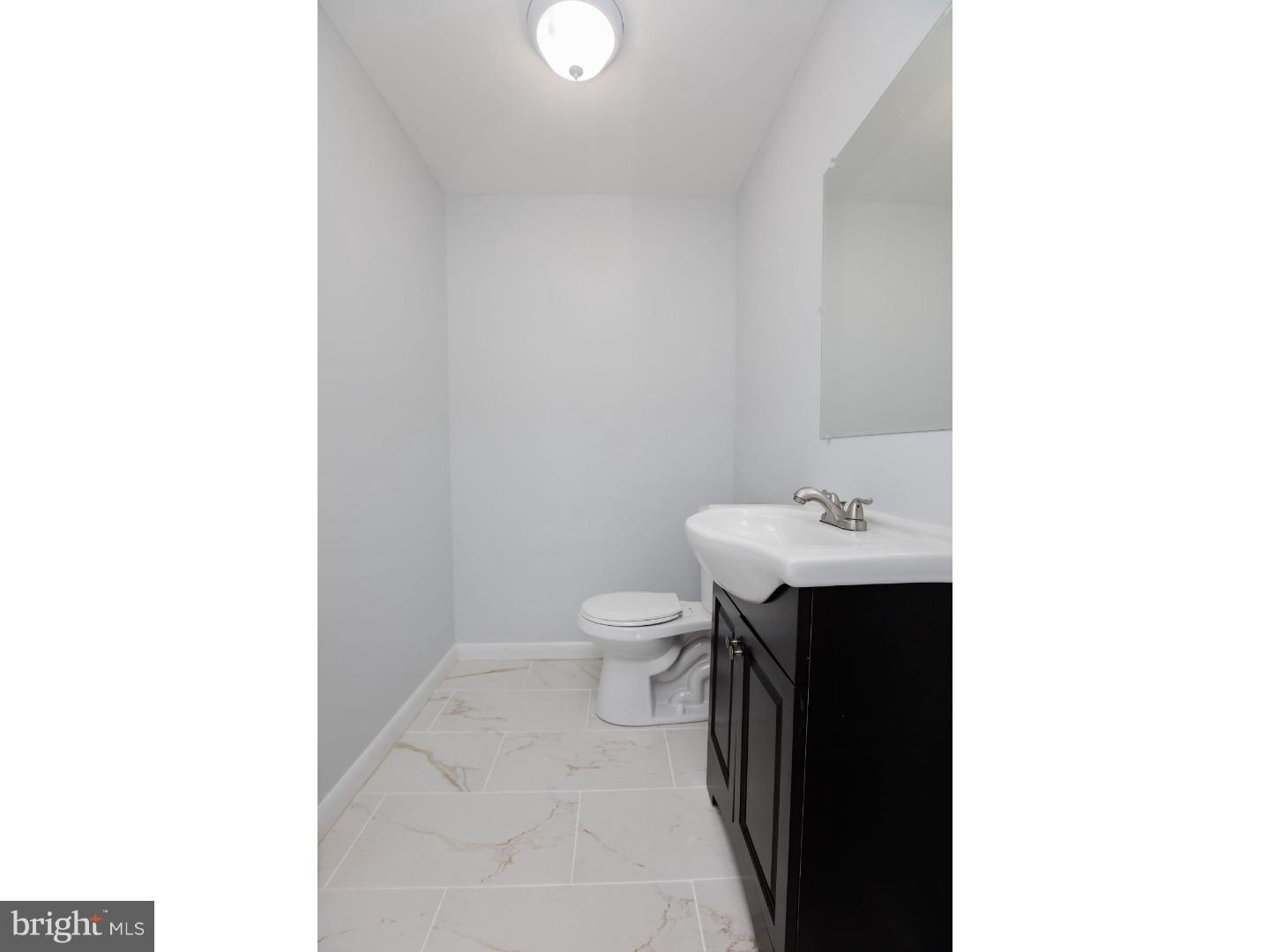 810 Coppock Lane Springfield, PA 19064 - Photo 19 of 24 a bathroom with a sink and a toilet