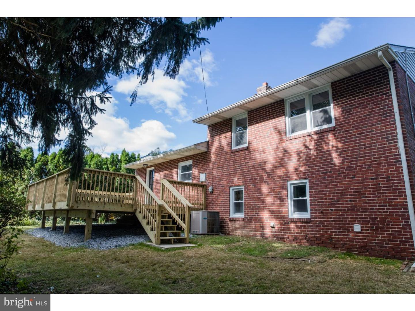 810 Coppock Lane Springfield, PA 19064 - Photo 22 of 24 a view of house with backyard and deck