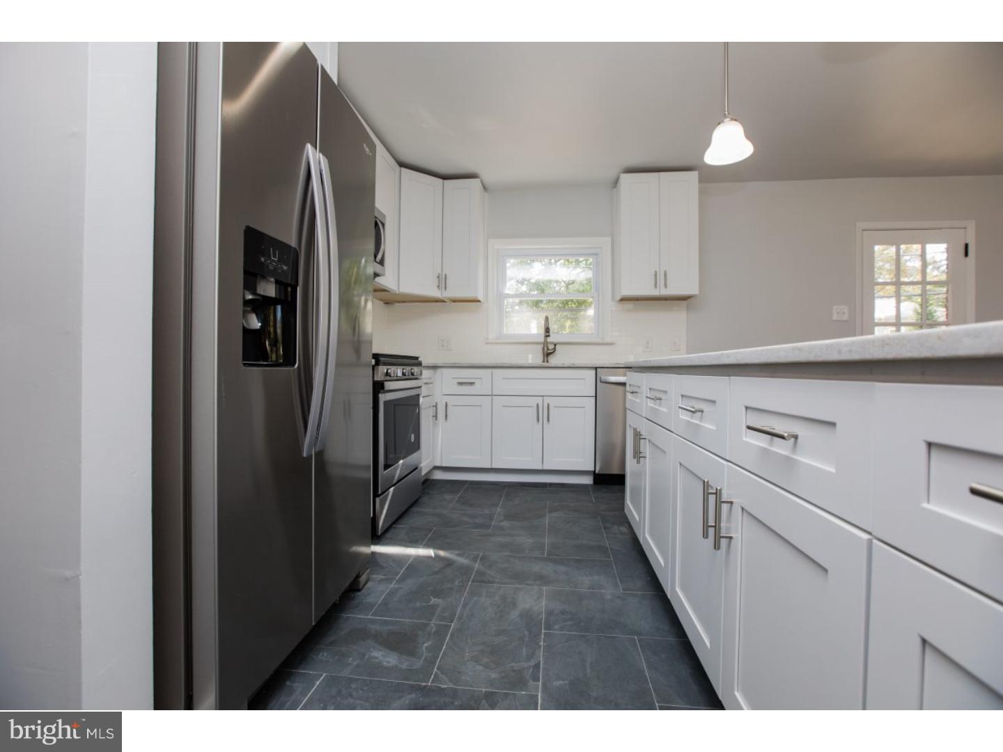 810 Coppock Lane Springfield, PA 19064 - Photo 8 of 24 a kitchen with cabinets and stainless steel appliances