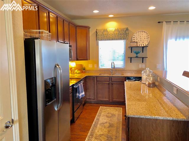 7888 Calabash Road Colorado Springs, CO 80908 - Photo 4 of 25 Kitchen Viewed From Formal Dining
