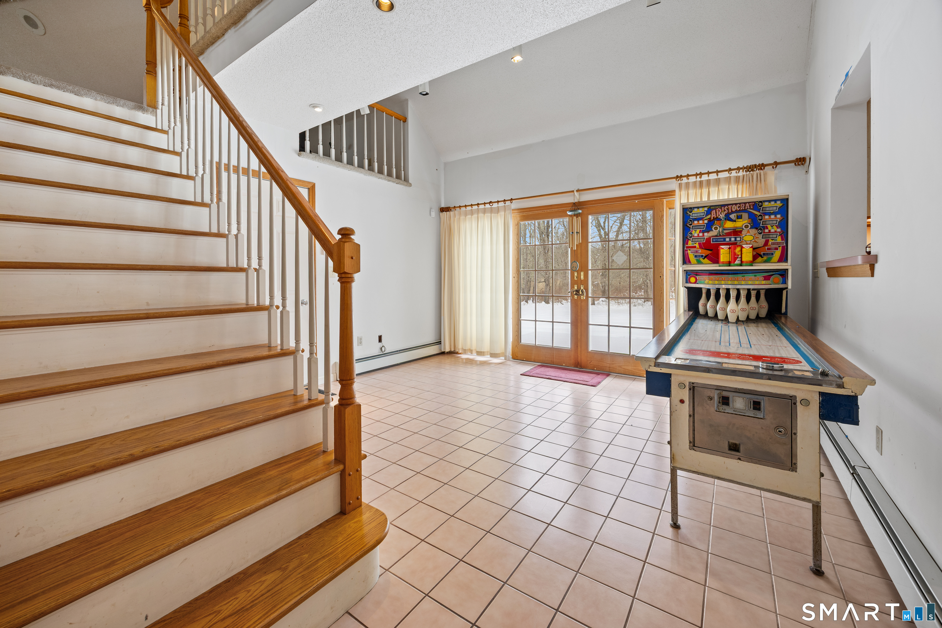 115 Alain White Road Morris, CT 06763 - Photo 11 of 36 Office or game room with stairs to bonus room above garage.