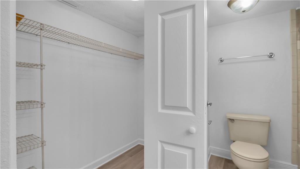 5681 Riverside Drive, Unit 101A6 Coral Springs, FL 33067 - Photo 14 of 24 a bathroom with a toilet and a shower