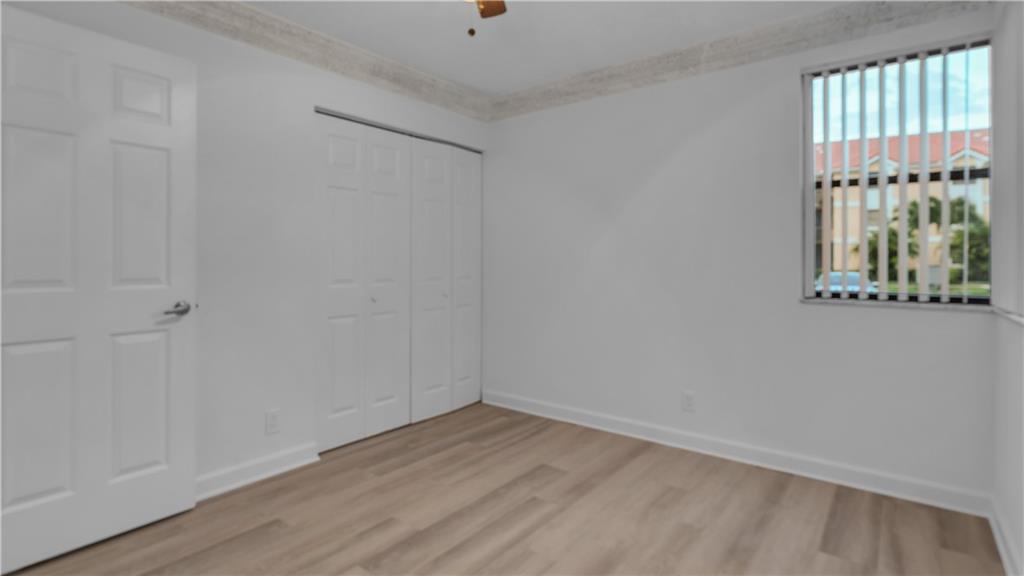 5681 Riverside Drive, Unit 101A6 Coral Springs, FL 33067 - Photo 18 of 24 a view of an empty room with a window