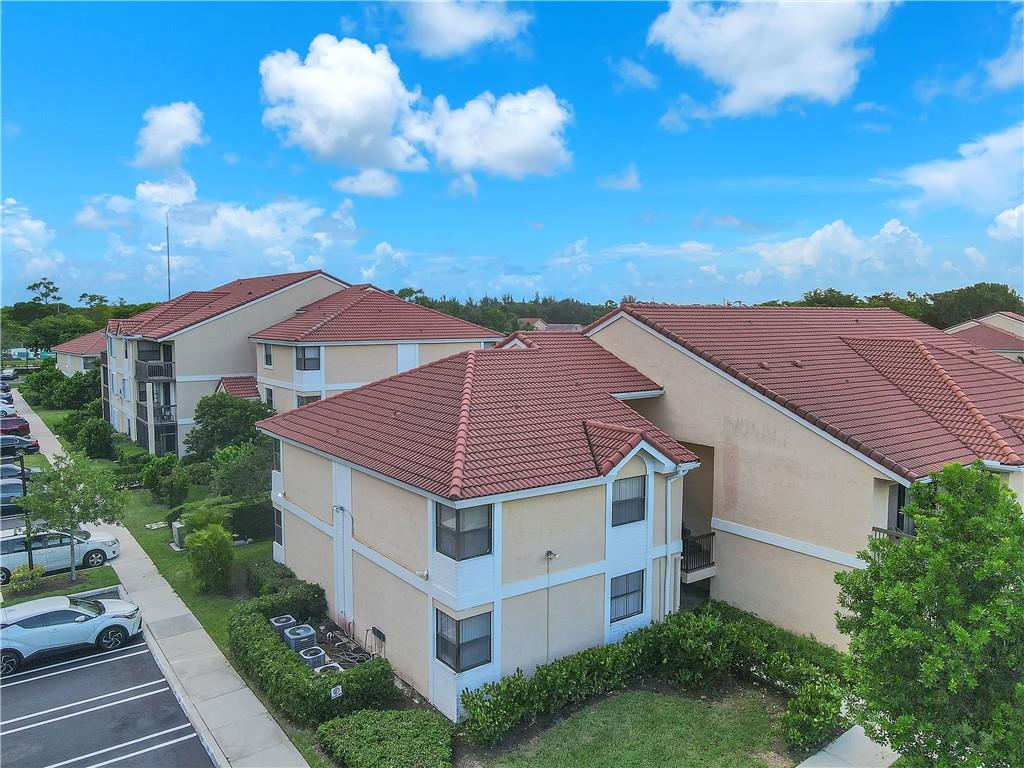5681 Riverside Drive, Unit 101A6 Coral Springs, FL 33067 - Photo 3 of 24 a aerial view of a house with yard and mountain view in back