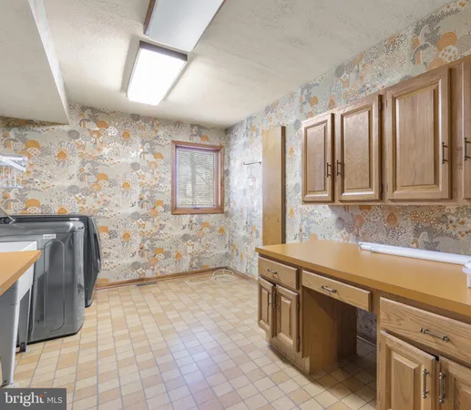 a bathroom with a sink a toilet and shower curtain