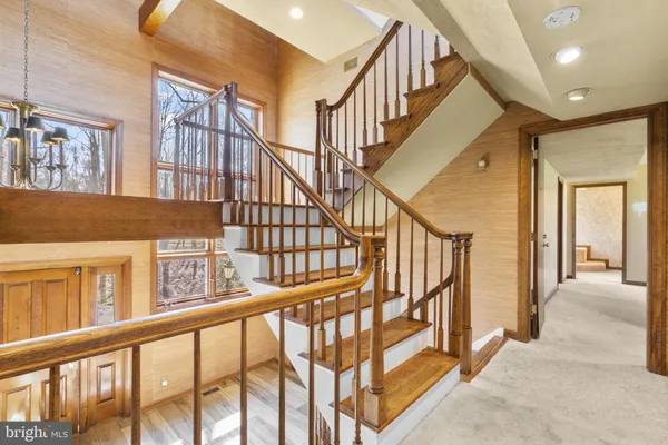 a view of an entryway wooden floor and door
