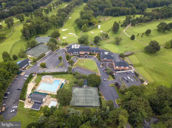 a view of a backyard with swimming pool