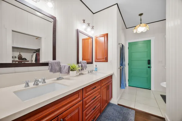 a bathroom with a sink and a mirror