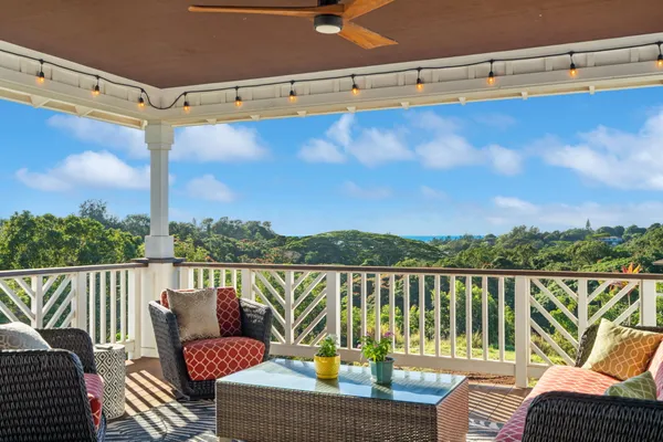 a view of a balcony with lake view and wooden floor