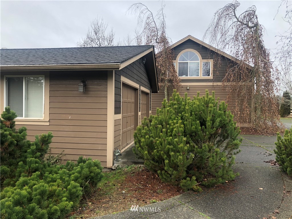 29816 Webster Road East Graham, WA 98338 - Photo 3 of 40 a front view of a house with garden