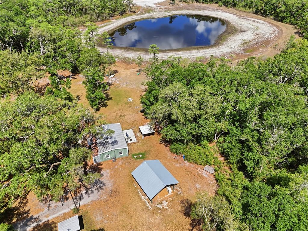 401 Southeast Falcon Road Branford, FL 32008 - Photo 19 of 76 an aerial view of a house with yard and trees in the background