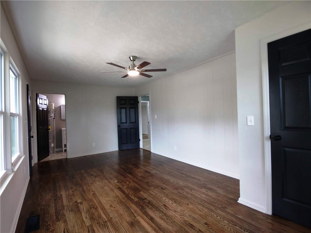 907 Gadsden Road Southwest Cave Spring, GA 30124 - Photo 11 of 26 a view of an empty room with wooden floor