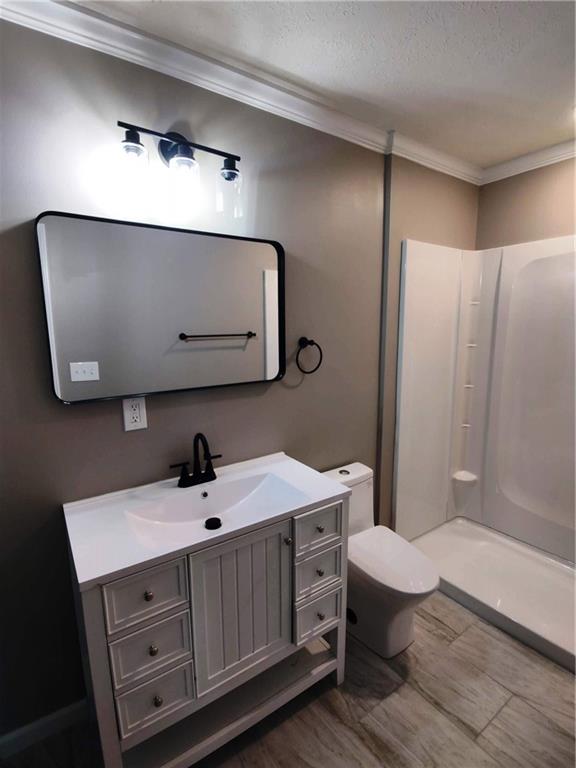 907 Gadsden Road Southwest Cave Spring, GA 30124 - Photo 12 of 26 a bathroom with a sink a toilet and mirror
