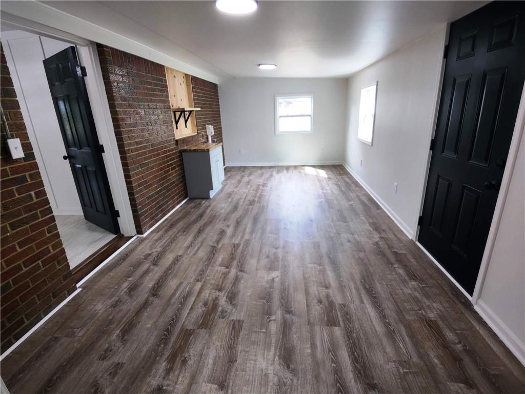 907 Gadsden Road Southwest Cave Spring, GA 30124 - Photo 14 of 26 a view of a room with wooden floor and window