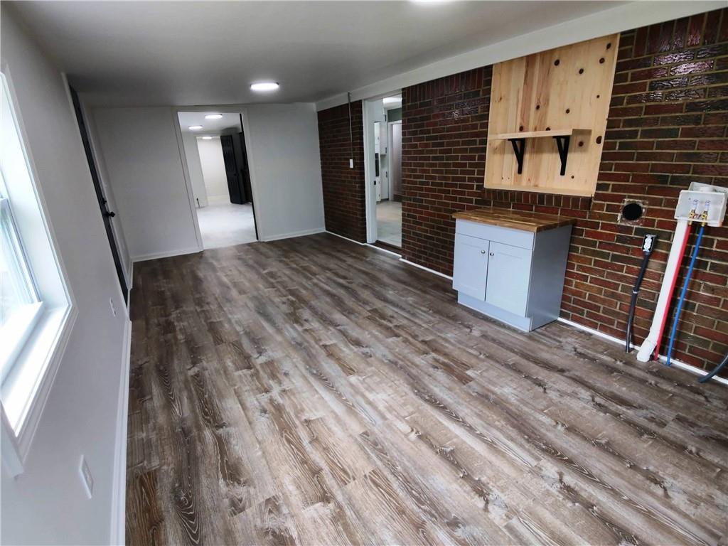 907 Gadsden Road Southwest Cave Spring, GA 30124 - Photo 16 of 26 a view of a refrigerator in kitchen and an empty room