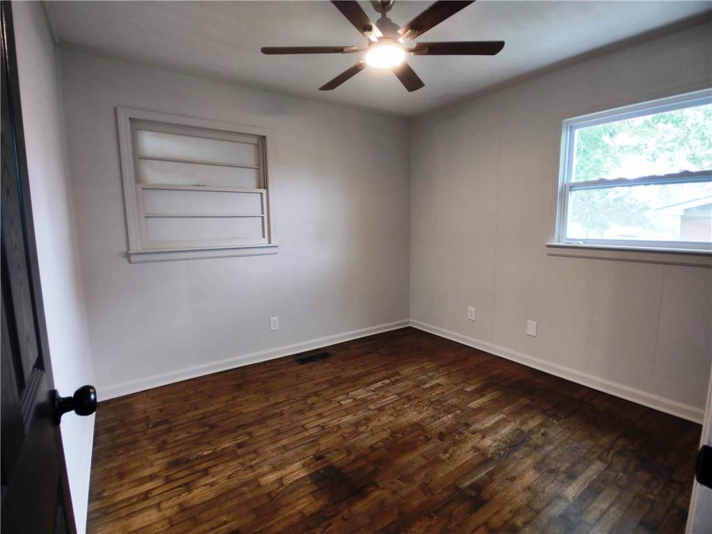 907 Gadsden Road Southwest Cave Spring, GA 30124 - Photo 21 of 26 wooden floor in an empty room with a window