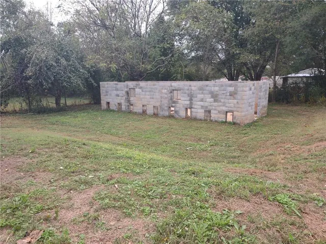 a backyard of a house with lots of green space