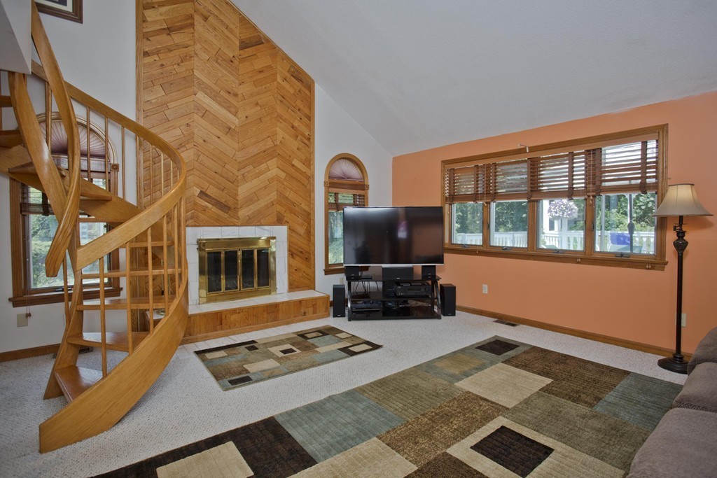 97 Calley Street Springfield, MA 01129 - Photo 17 of 30 a living room with fireplace furniture and a flat screen tv