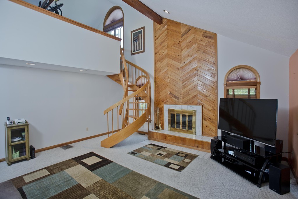 97 Calley Street Springfield, MA 01129 - Photo 20 of 30 a living room with furniture a flat screen tv and a window