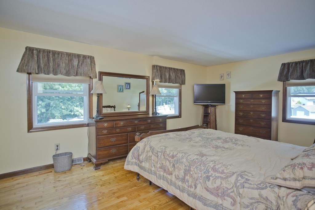 97 Calley Street Springfield, MA 01129 - Photo 22 of 30 a bedroom with a bed and a dresser