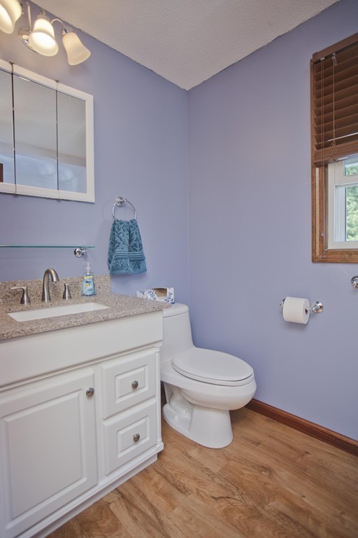 97 Calley Street Springfield, MA 01129 - Photo 26 of 30 a bathroom with a granite countertop toilet sink and mirror