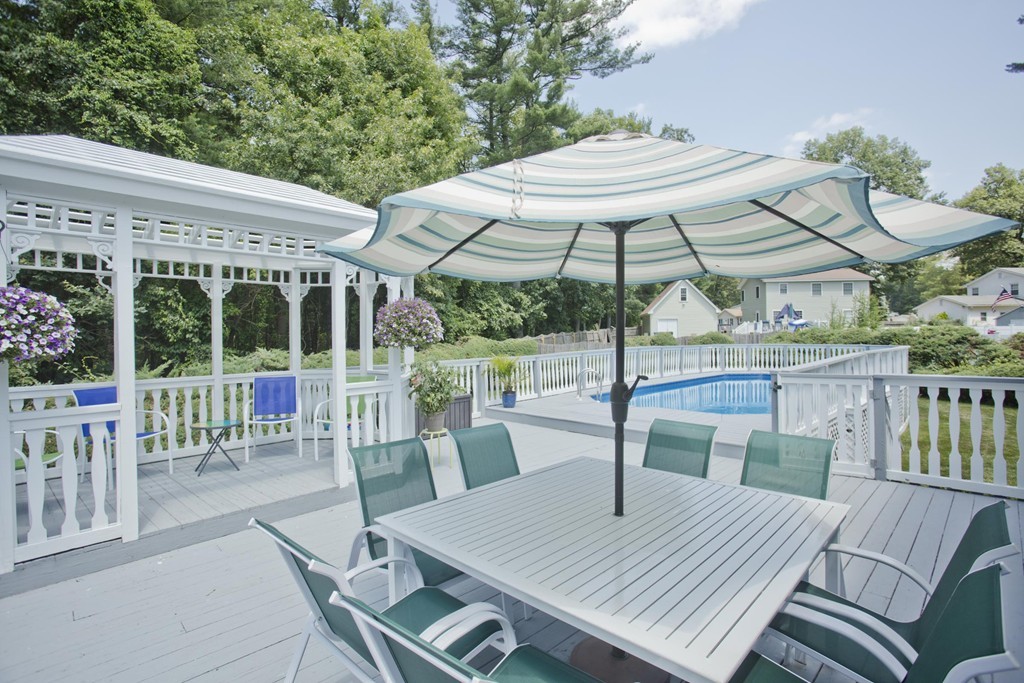 97 Calley Street Springfield, MA 01129 - Photo 4 of 30 a view of a patio with a table chairs and a table