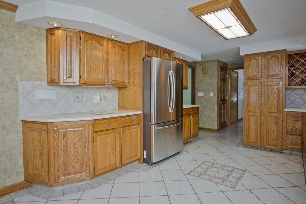 97 Calley Street Springfield, MA 01129 - Photo 10 of 30 a kitchen with stainless steel appliances granite countertop a refrigerator and a sink