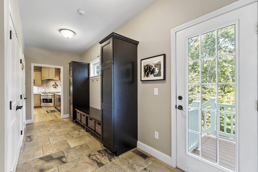19 Fitch Farm Road Sterling, MA 01564 - Photo 15 of 42 a view of a hallway with wooden floor and windows