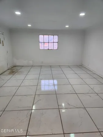 a kitchen with a stove a sink and a refrigerator