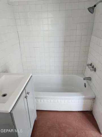 a bathroom with a toilet a sink and bathtub
