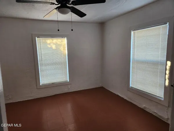 a view of a hallway with wooden door