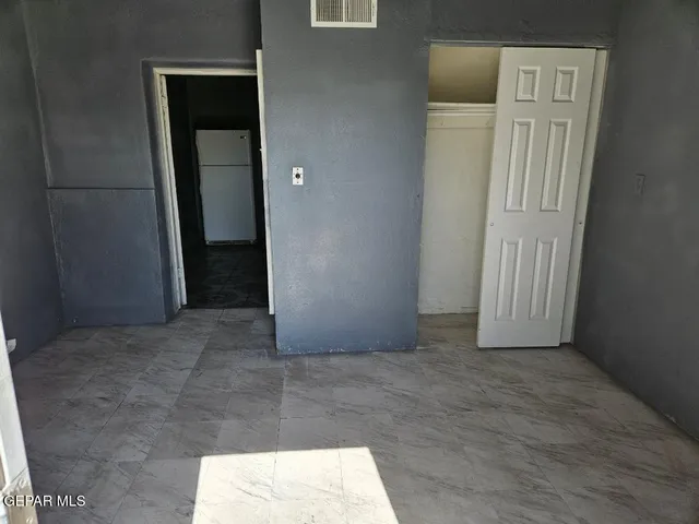 a sink and a stove top oven sitting inside of a kitchen