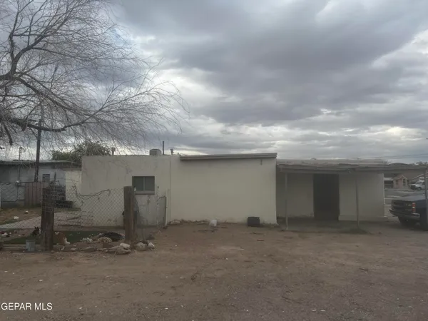 a kitchen with a sink and a stove top oven