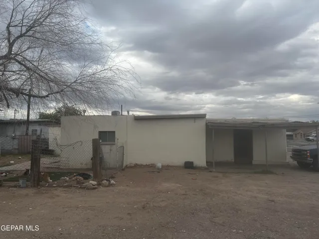 a kitchen with a sink and a stove top oven
