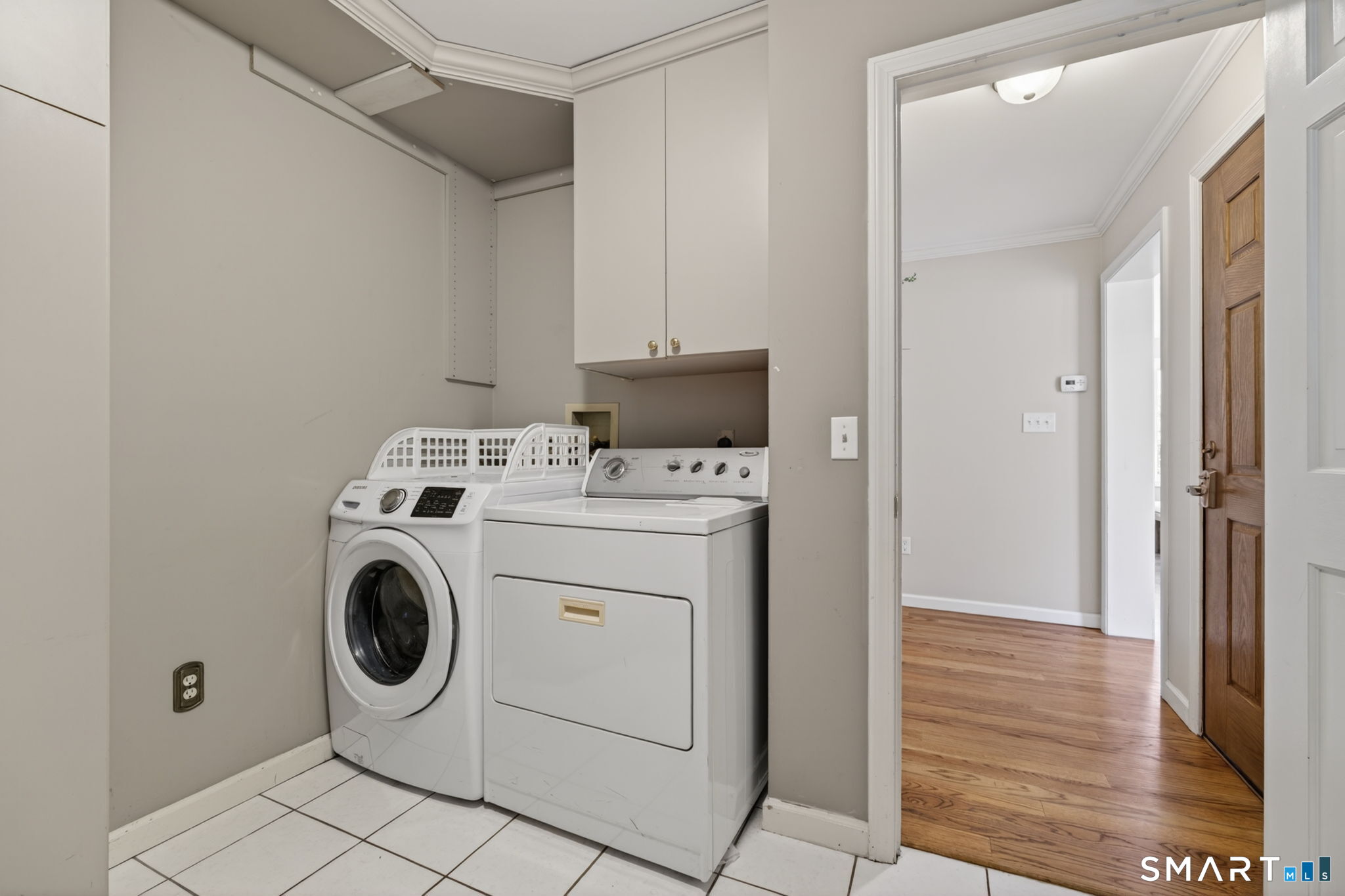 2 Davis Road Woodbridge, CT 06525 - Photo 23 of 40 FIRST FLOOR LAUNDRY ROOM WITH CABINETS