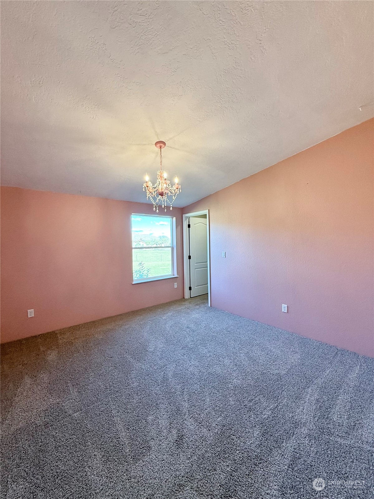 18 Root Road Okanogan, WA 98840 - Photo 15 of 36 wooden floor in an empty room with a window