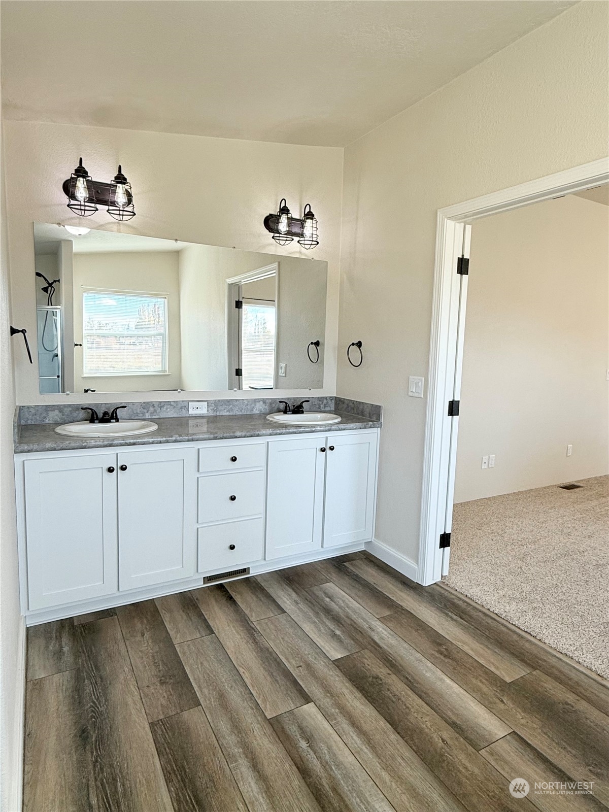 18 Root Road Okanogan, WA 98840 - Photo 24 of 36 a view of a bathroom with a sink mirror and window