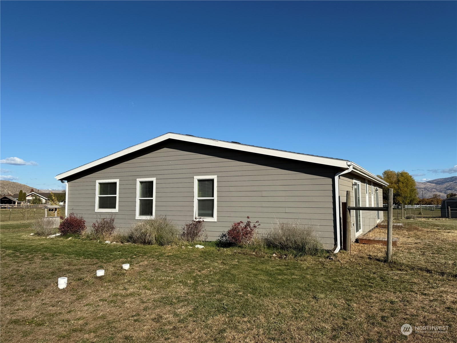 18 Root Road Okanogan, WA 98840 - Photo 28 of 36 a house view with a backyard space