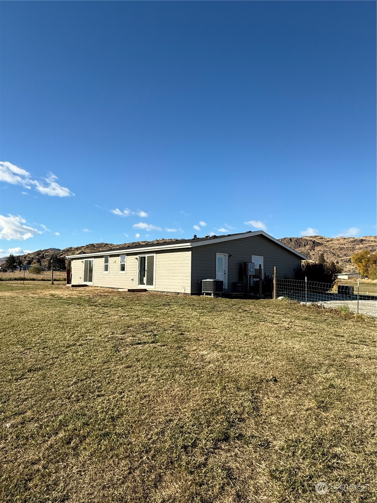 18 Root Road Okanogan, WA 98840 - Photo 29 of 36 a view of a house with a yard