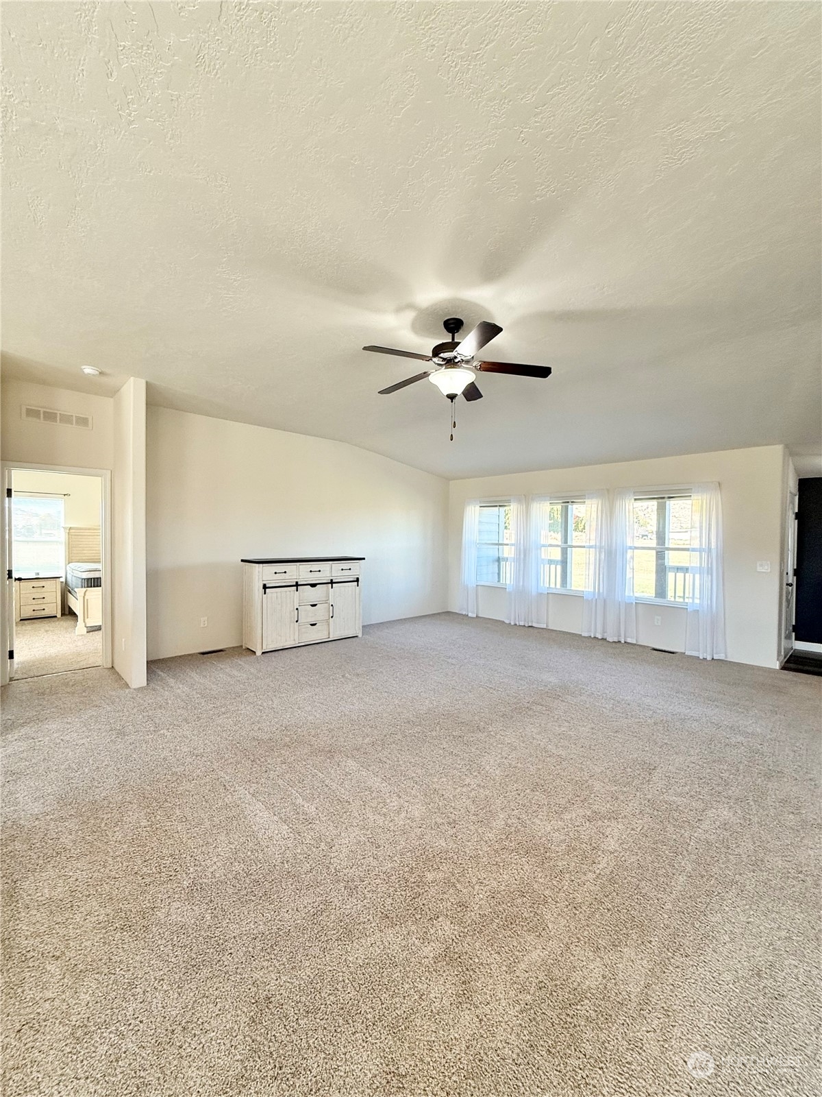 18 Root Road Okanogan, WA 98840 - Photo 5 of 36 a view of a livingroom with a ceiling fan and window