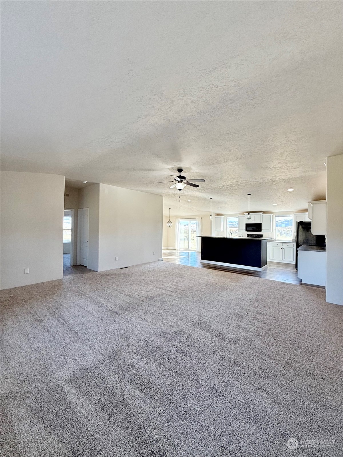 18 Root Road Okanogan, WA 98840 - Photo 6 of 36 a view of kitchen and a fireplace