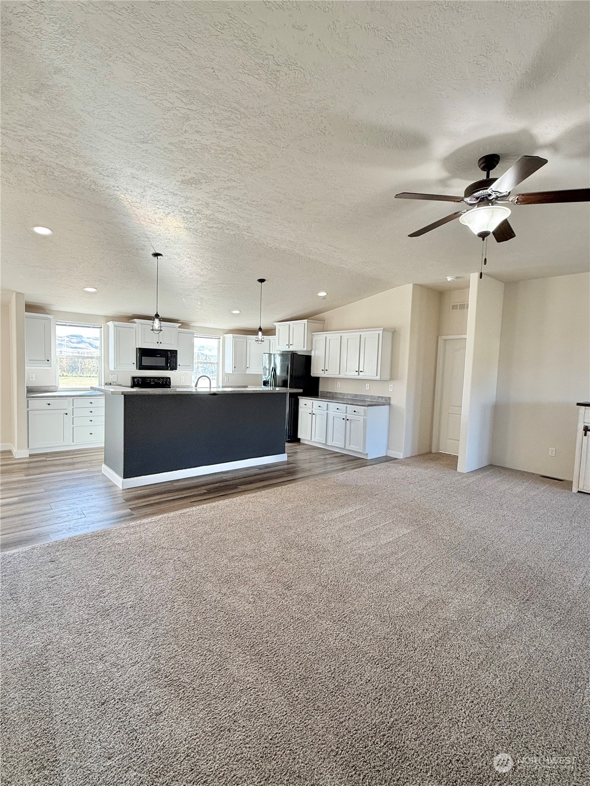 18 Root Road Okanogan, WA 98840 - Photo 8 of 36 a view of a kitchen with a sink and a kitchen