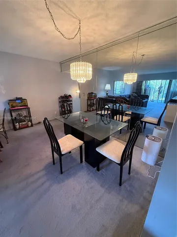 a view of living room with furniture and a flat screen tv