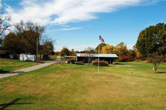 3100 Lights Chapel Road Greenbrier, TN 37073 - Photo 1 of 18 Gravel road is property owned and leads to mobile home and back pastures.