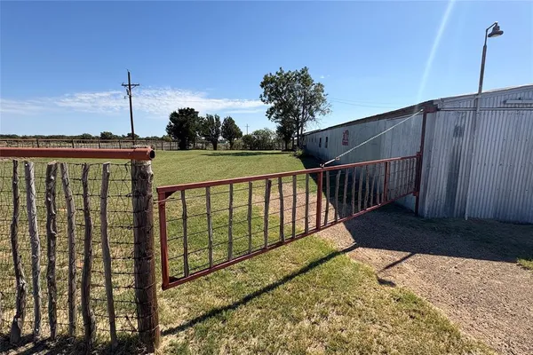 a room with wooden floor and furniture