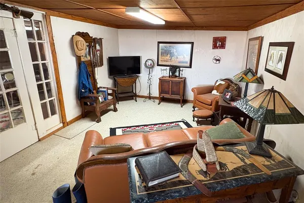 a bathroom with a toilet a sink and a mirror