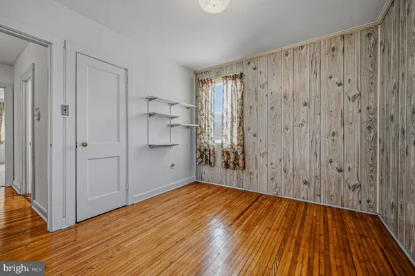 a view of wooden floor in an empty room