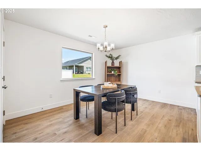 a spacious bedroom with a bed and a window