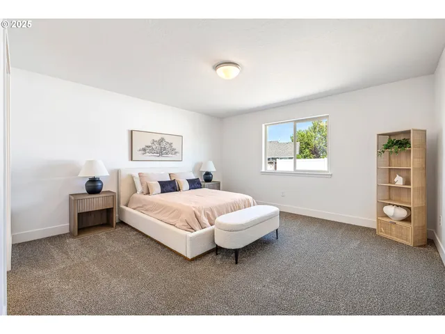 a bedroom with a bed and a couch