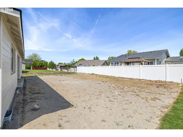 a house with a wooden fence